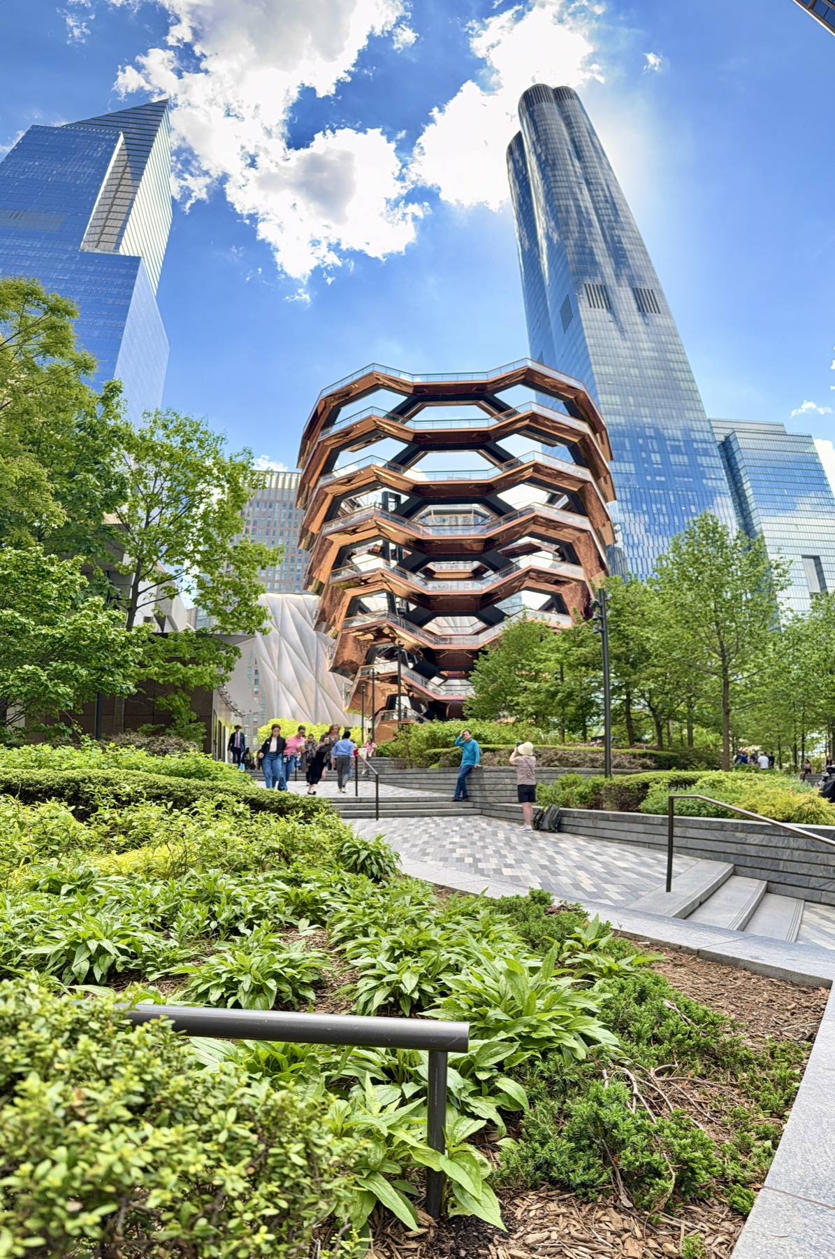 Urban green infrastructure landscape surrounded by tall city buildings