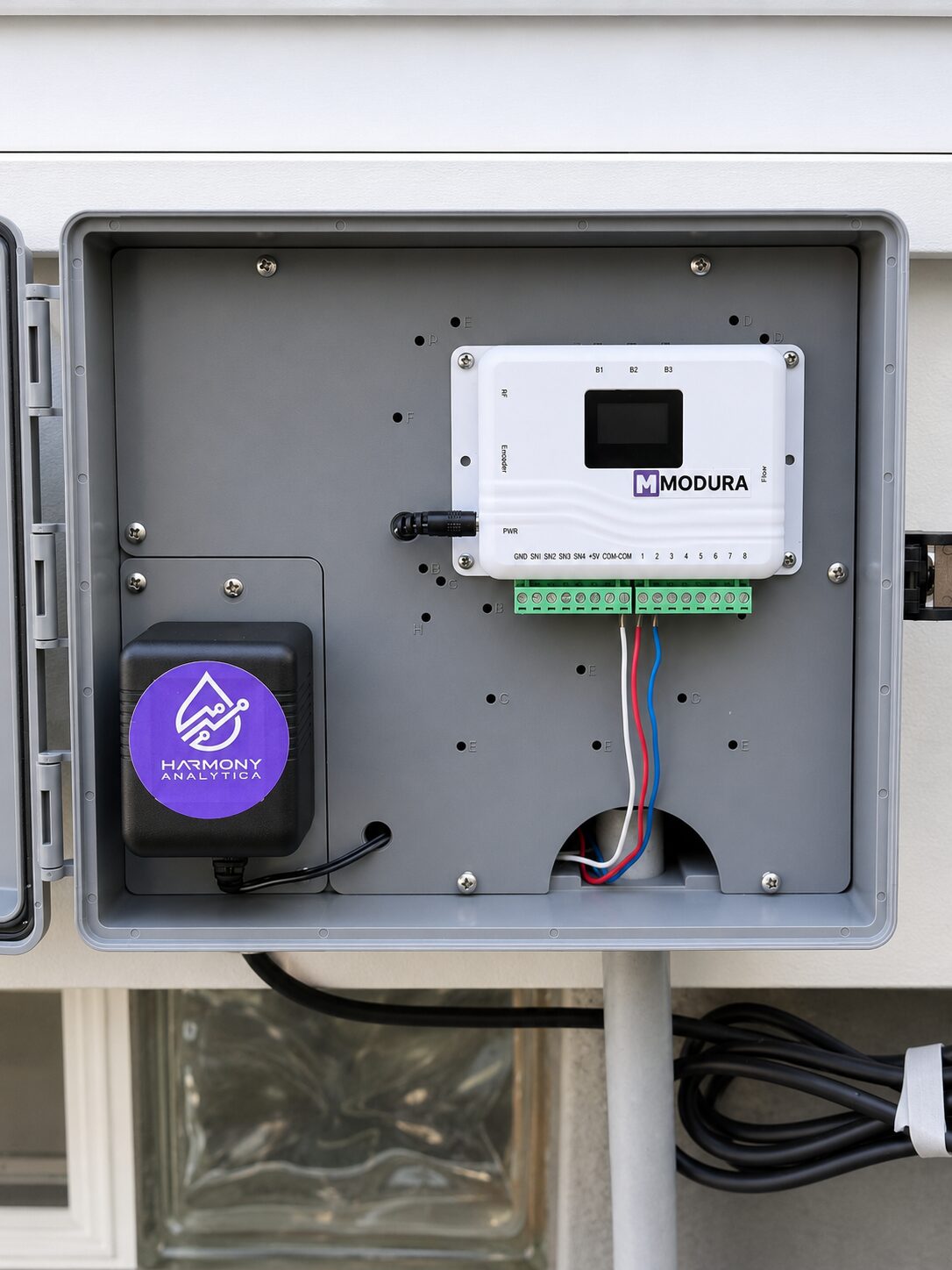Open MODURA HUB enclosure showing controller wiring and gateway equipment